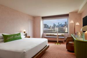 a hotel room with a bed and a view of a city at Renaissance Austin Downtown Hotel in Austin +147 photos