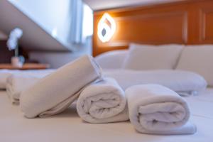 Postel nebo postele na pokoji v ubytování Szinbád Hotel