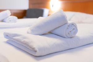 Postel nebo postele na pokoji v ubytování Szinbád Hotel