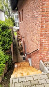 a brick wall with a stairway leading up to a building at 2-Zimmer Ferienwohnung, MONTEURZIMMER! 20 min zum CGN Flughafen. in Lohmar