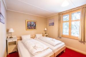 Postel nebo postele na pokoji v ubytování Chalet Surselva