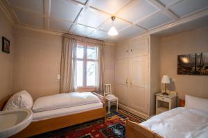 Postel nebo postele na pokoji v ubytování Chalet Surselva