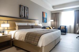 Llit o llits en una habitació de Djibouti Ayla Grand Hotel