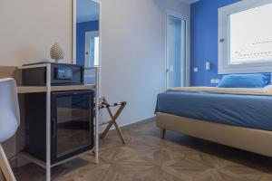 Postel nebo postele na pokoji v ubytování Gigli Rooms