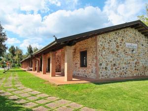 a stone building with a sign on it at il Carpignone in La Pesta
