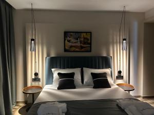 a bedroom with a large bed with two tables at Luxury Villa Mikolina in Kornić +44 photos