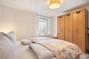 a bedroom with a large bed and a window at Ferienwohnung zum Specht 