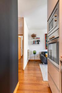 a hallway with a living room with a couch at Breeze Apartment - Matosinhos in Matosinhos