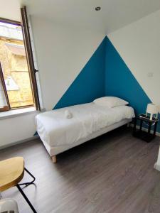 Katil atau katil-katil dalam bilik di Gîte Le Rempart - 3 étoiles - 6 personnes -