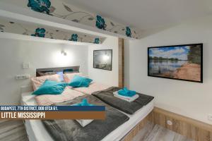 Ліжко або ліжка в номері Little Americas Ring Apartments