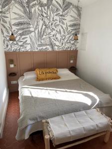 a bedroom with a bed with a pillow on it at Studio centre ville Saint Tropez avec parking in Saint-Tropez