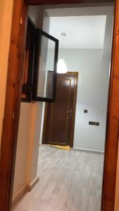 an empty room with a door and a hallway at Furnished apartment in Marrakesh in Tamensourt