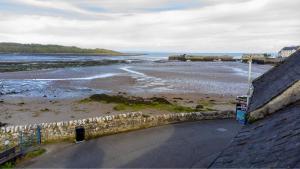 a view of the beach from the roof of a building at Harbour Inn Appartments in Garlieston