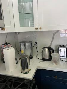 a kitchen counter with appliances on a counter top at Lovely 2bedroom next to Santa Monica college in Los Angeles
