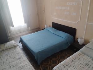A bed or beds in a room at Al Duomo