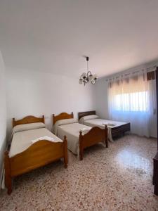 Ένα ή περισσότερα κρεβάτια σε δωμάτιο στο Casa Rural Chache CASTO