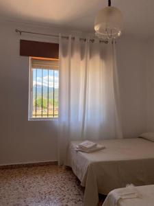 Ένα ή περισσότερα κρεβάτια σε δωμάτιο στο Casa Rural Chache CASTO