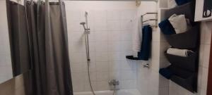 a bathroom with a shower with a shower curtain at gemütliches Apartment in Marl - WG 1 in Marl