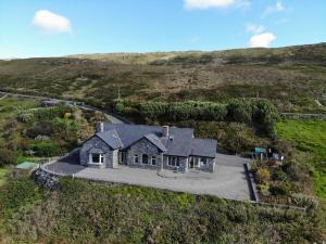 an aerial view of a house on a hill at Once Upon a Tide in Clifden