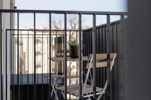a plant sitting on a table on a balcony at Studio with a balcony and AC - Rajska 3 street in Kraków