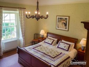 a bedroom with a bed with two pillows on it at Kill House, Kingstown in Clifden