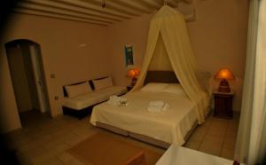Postel nebo postele na pokoji v ubytování Petali Village Hotel