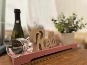 a bottle of wine and a glass on a table at Glamping Zelt in Templin