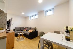 a living room with a couch and a table at Apartment Zvoncac in Split