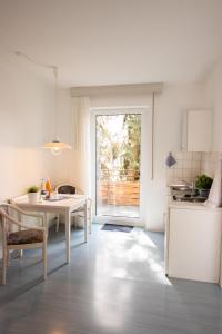 a kitchen and dining room with a table and a window at Pension Krone in Schwäbisch Gmünd