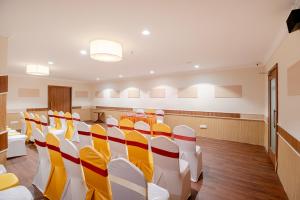 a conference room with chairs and tables in it at Hotel Seasons Inn in Nellore