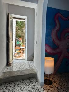 Postel nebo postele na pokoji v ubytování La dolce casa del polpo rosa