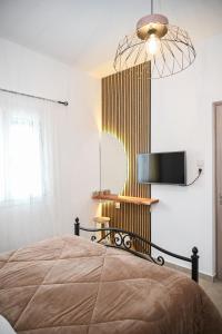 Postel nebo postele na pokoji v ubytování Gemilos Nest