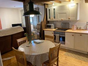 a kitchen with a table and chairs in a kitchen at Easterley Uk31585 in Clifford