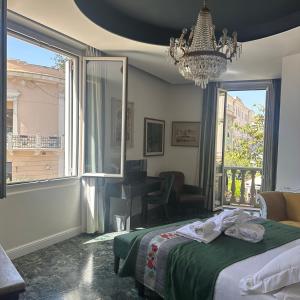a bedroom with a bed and a large window at Kemani Villa Sara Olbia in Olbia