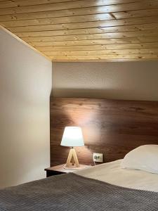 A bed or beds in a room at Hotel Axien Kazbegi