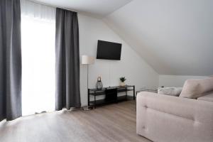 TV a/nebo společenská místnost v ubytování Schöne Apartments in Lengerich I home2share