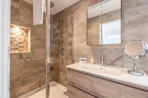 a bathroom with a sink and a shower at Windsor Charm Spacious 3-Bed, Parking & Garden - By Tempstay in Windsor +12 photos