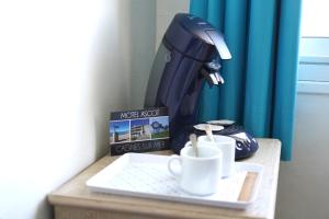 Kavos ir arbatos ruošimo rinkinys apgyvendinimo įstaigoje MOTEL ASCOT - Hotel & Appartements