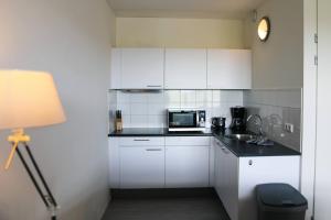 Kuchyň nebo kuchyňský kout v ubytování Strand Appartementen Wemeldinge