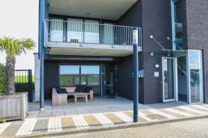 Balkón nebo terasa v ubytování Strand Appartementen Wemeldinge