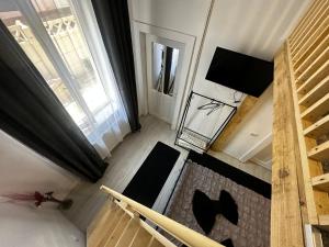 an overhead view of a living room with chairs and a television at Vila Ana Boutique Hotel in Cluj-Napoca