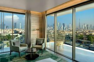 a hotel room with a view of the city at Hyatt Centric Jumeirah Dubai - Executive Room - UAE in Dubai