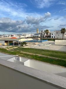 a view of a parking lot with a skate park at Hotel Luna Lido in Torre San Giovanni Ugento