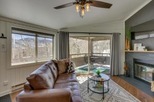a living room with a couch and a fireplace at Cozy La Veta Condo Walk to Cuchara Mountain Park! in La Veta