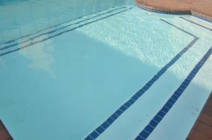 an empty swimming pool with water in it at Sea view short stay home in Durban