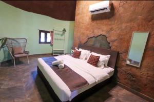 Un ou plusieurs lits dans un hébergement de l'établissement Mushroom Villa Best homestay