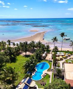 an aerial view of a beach and the ocean at Pousada Polymar in Maragogi