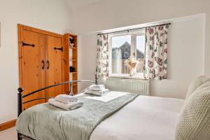 Postel nebo postele na pokoji v ubytování Starling cottage + 20 fotografií