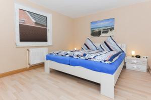 Postel nebo postele na pokoji v ubytování Ferienhaus Windlicht