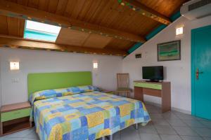 TV a/nebo společenská místnost v ubytování Hotel Marconi